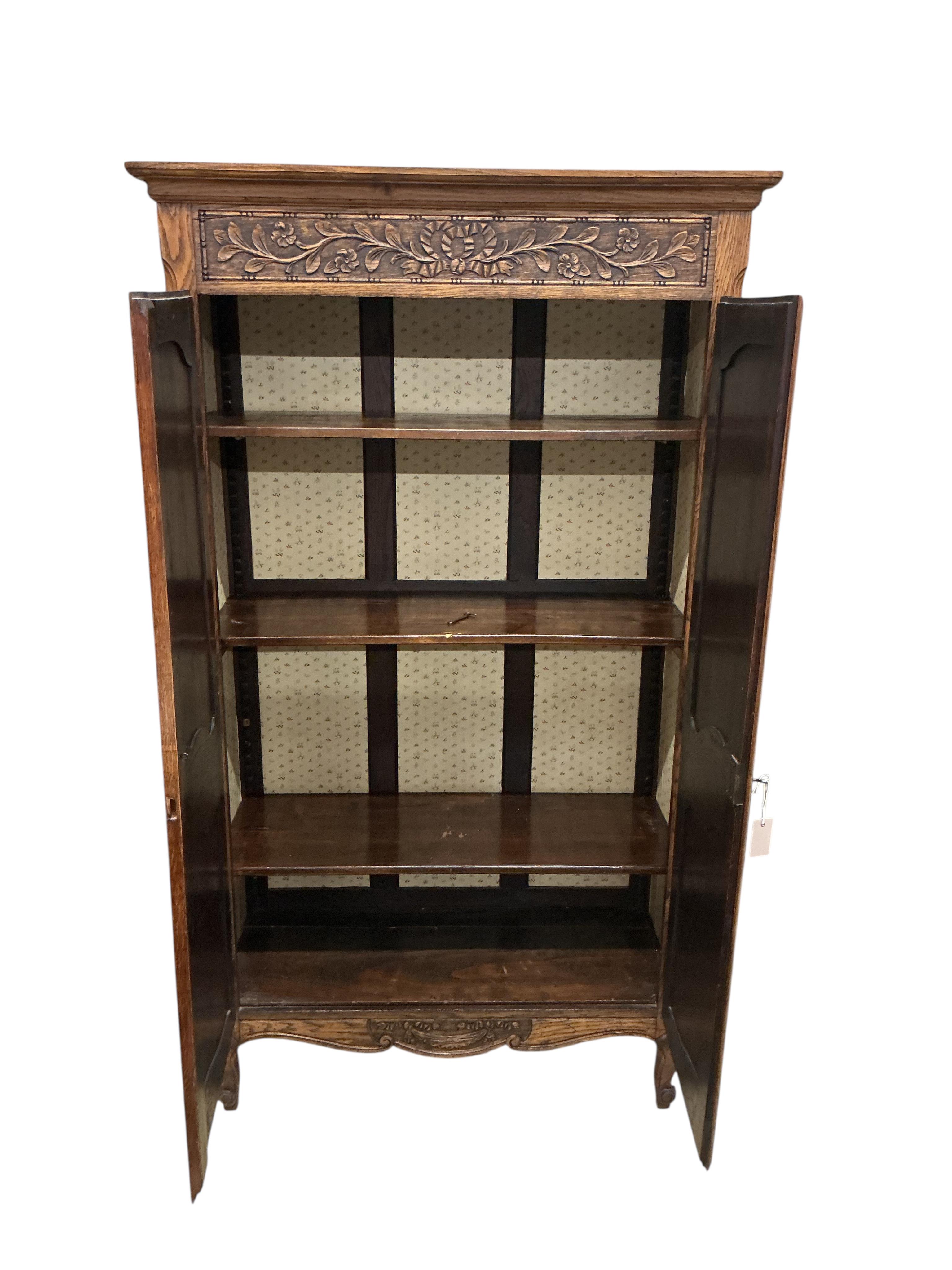 A small 18th century style French oak armoire, width 108cm, depth 45cm, height 189cm